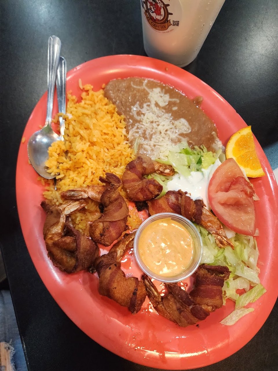 Restaurant menu highlighting mariscos and Sinaloa-style dishes.