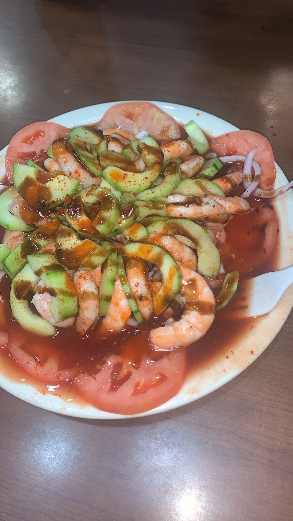 Restaurant menu highlighting mariscos and Sinaloa-style dishes.